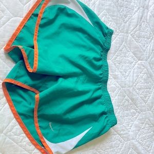 Nike shorts (teal/orange/white) size M